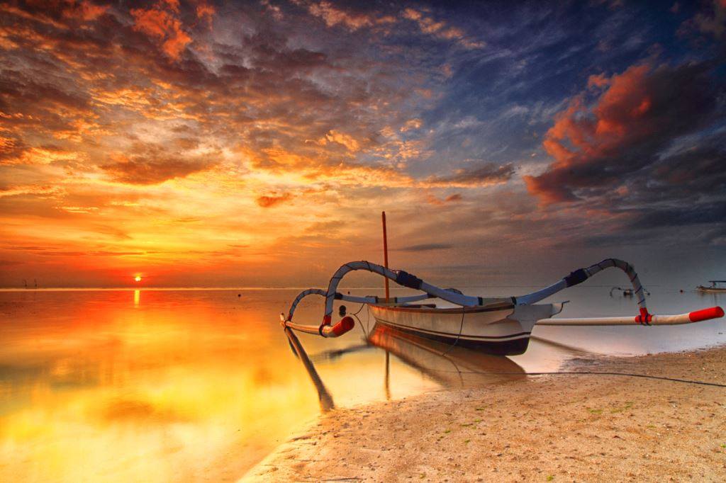 Boat near shore with sunrise